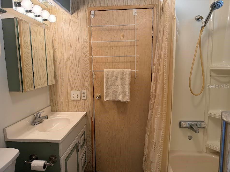 5168 Rubber Tree Circle New Port Richey, FL 34653 - Photo 13 of 36 a bathroom with a sink vanity tub and shower