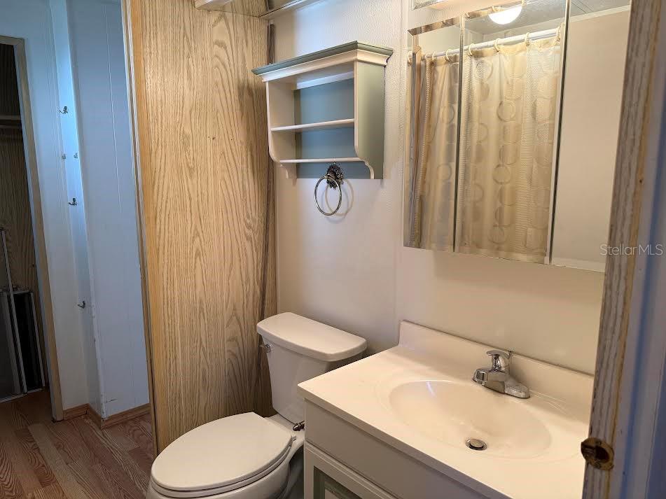 5168 Rubber Tree Circle New Port Richey, FL 34653 - Photo 15 of 36 a bathroom with a sink a toilet and shower