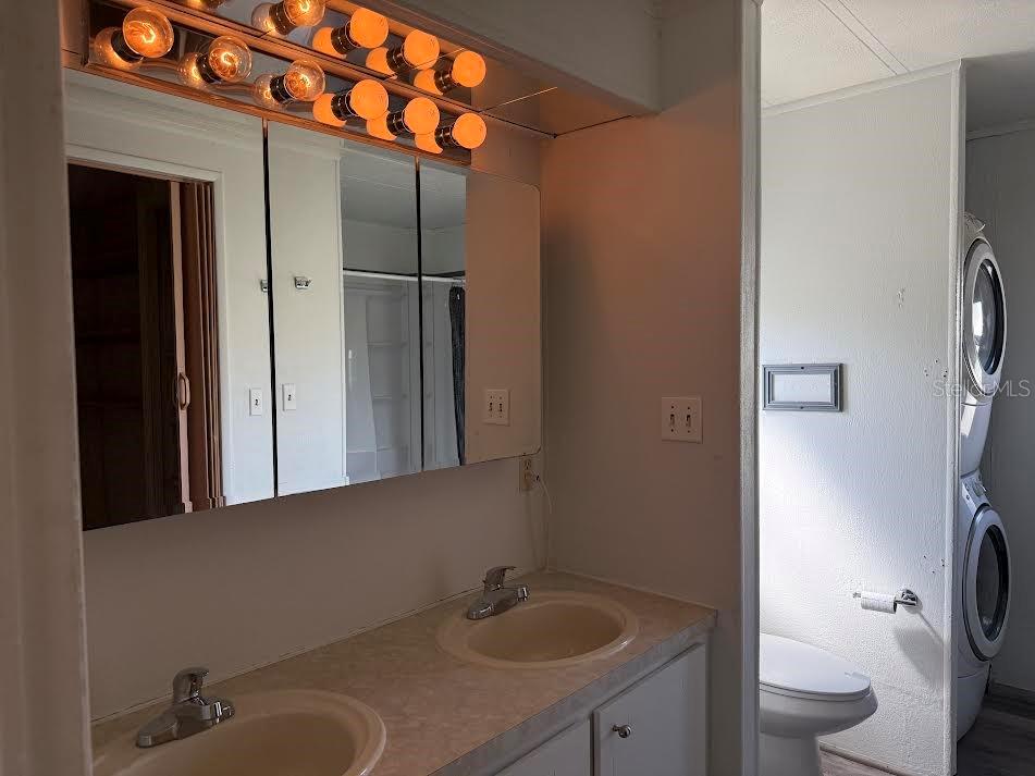 5168 Rubber Tree Circle New Port Richey, FL 34653 - Photo 20 of 36 a bathroom with a sink toilet and shower