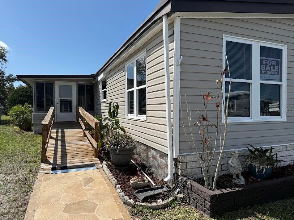 5168 Rubber Tree Circle New Port Richey, FL 34653 - Photo 27 of 36 a view of house with patio