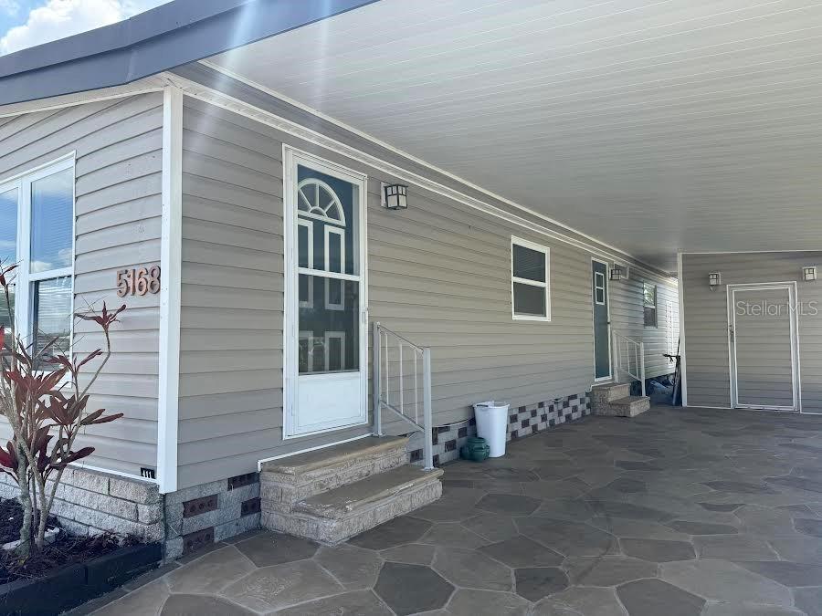 5168 Rubber Tree Circle New Port Richey, FL 34653 - Photo 32 of 36 a view of a house with a outdoor space
