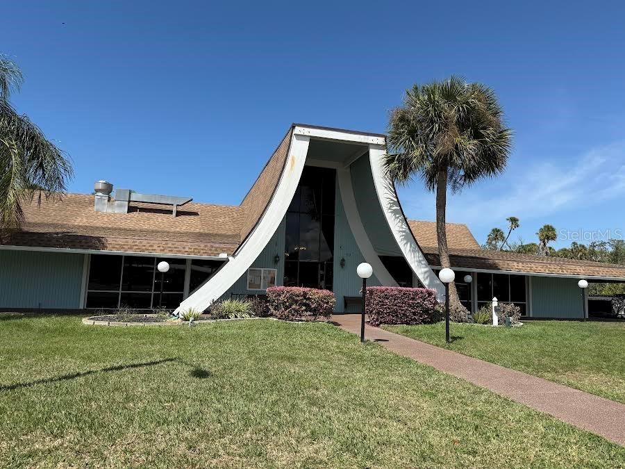 5168 Rubber Tree Circle New Port Richey, FL 34653 - Photo 35 of 36 a front view of a house with a garden