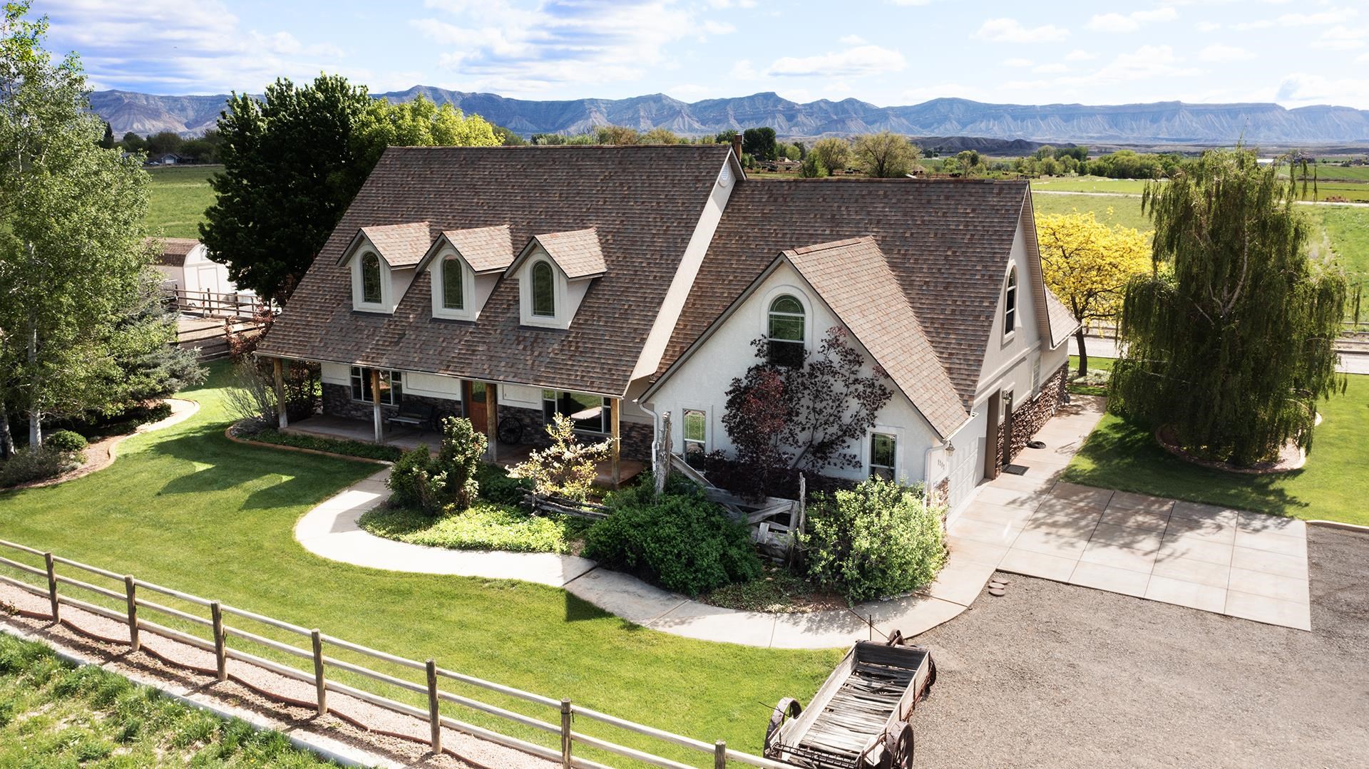 an aerial view of a house with garden space swimming pool