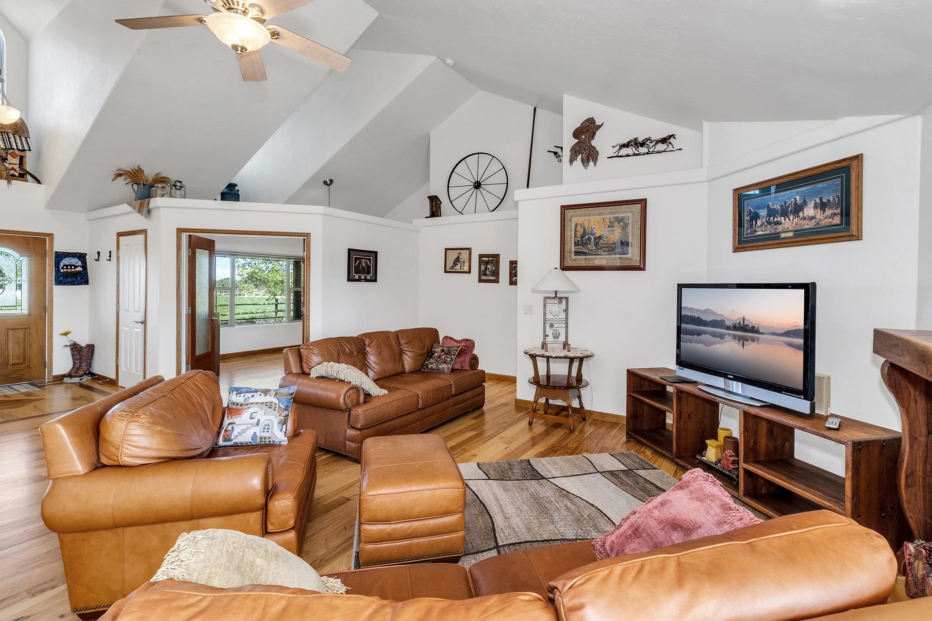 2302 Outback Ridge Road Grand Junction, CO 81505 - Photo 21 of 42 a living room with furniture and a flat screen tv