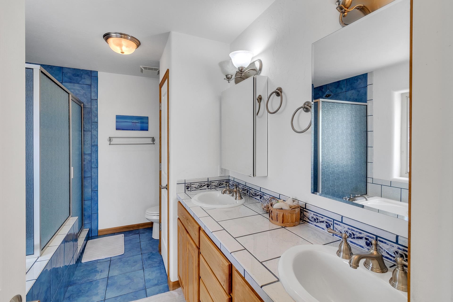 2302 Outback Ridge Road Grand Junction, CO 81505 - Photo 31 of 42 a bathroom with a sink and a mirror