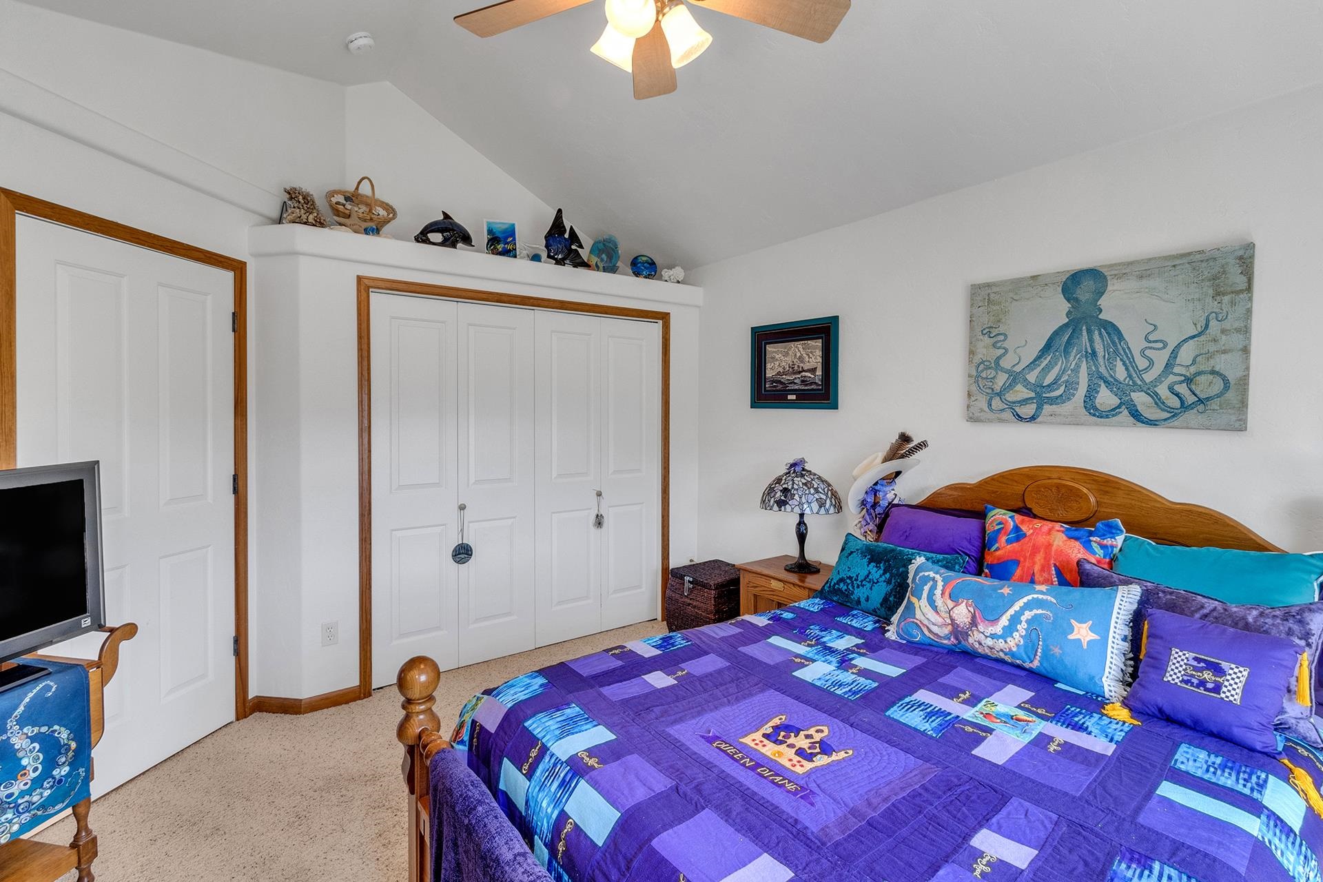 2302 Outback Ridge Road Grand Junction, CO 81505 - Photo 34 of 42 a bed room with a bed and a television
