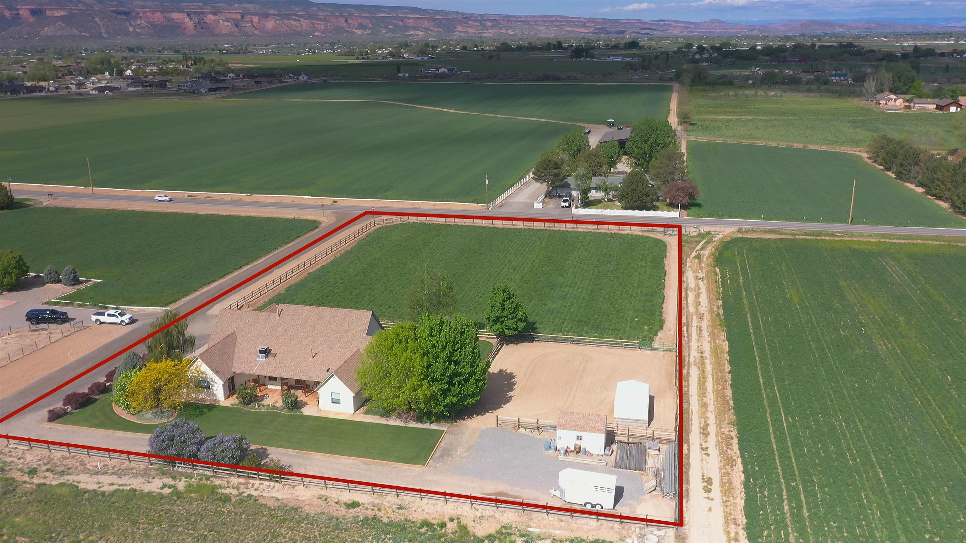 2302 Outback Ridge Road Grand Junction, CO 81505 - Photo 4 of 42 an aerial view of a house with a lake view