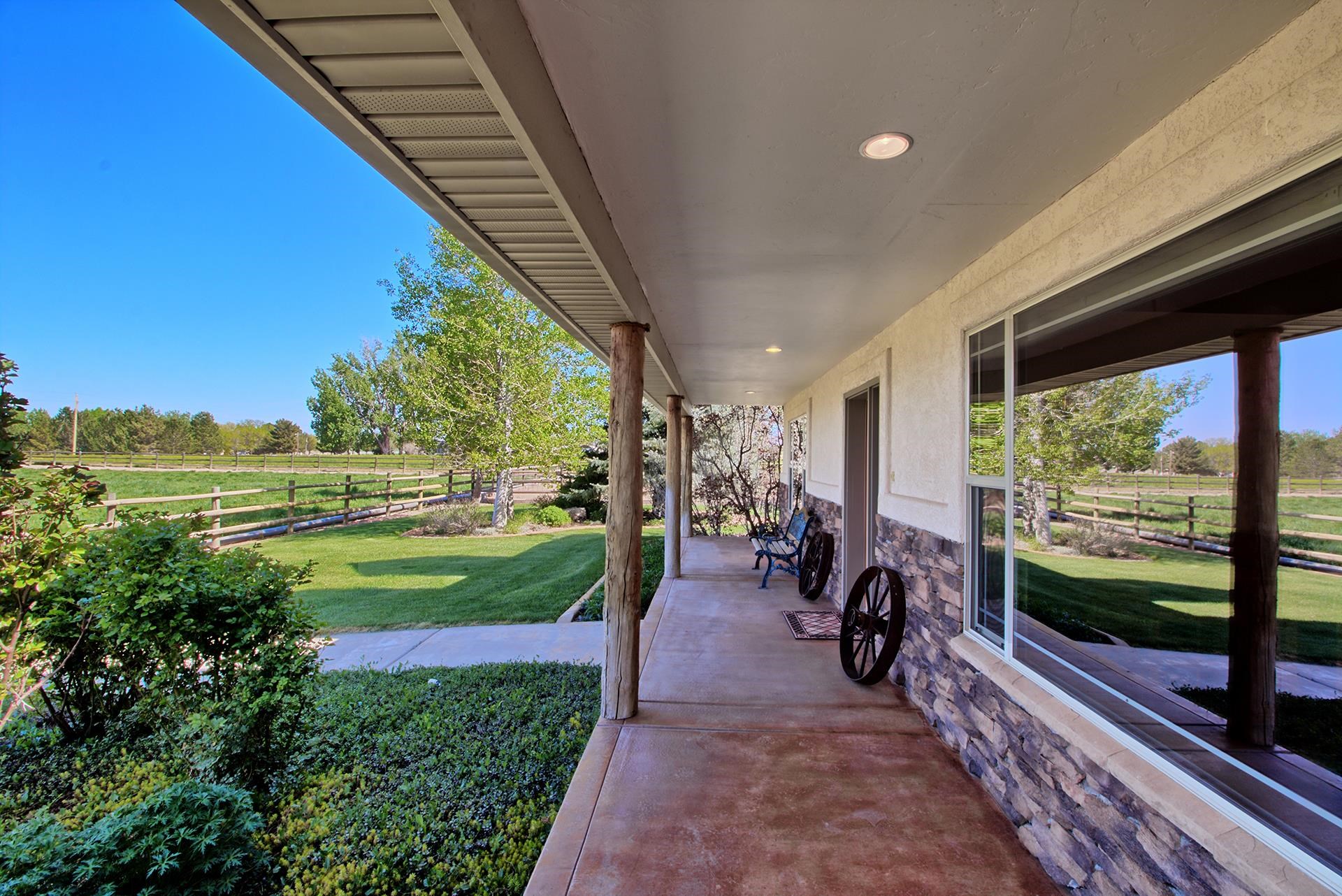 2302 Outback Ridge Road Grand Junction, CO 81505 - Photo 5 of 42 a view of a porch with chairs and backyard