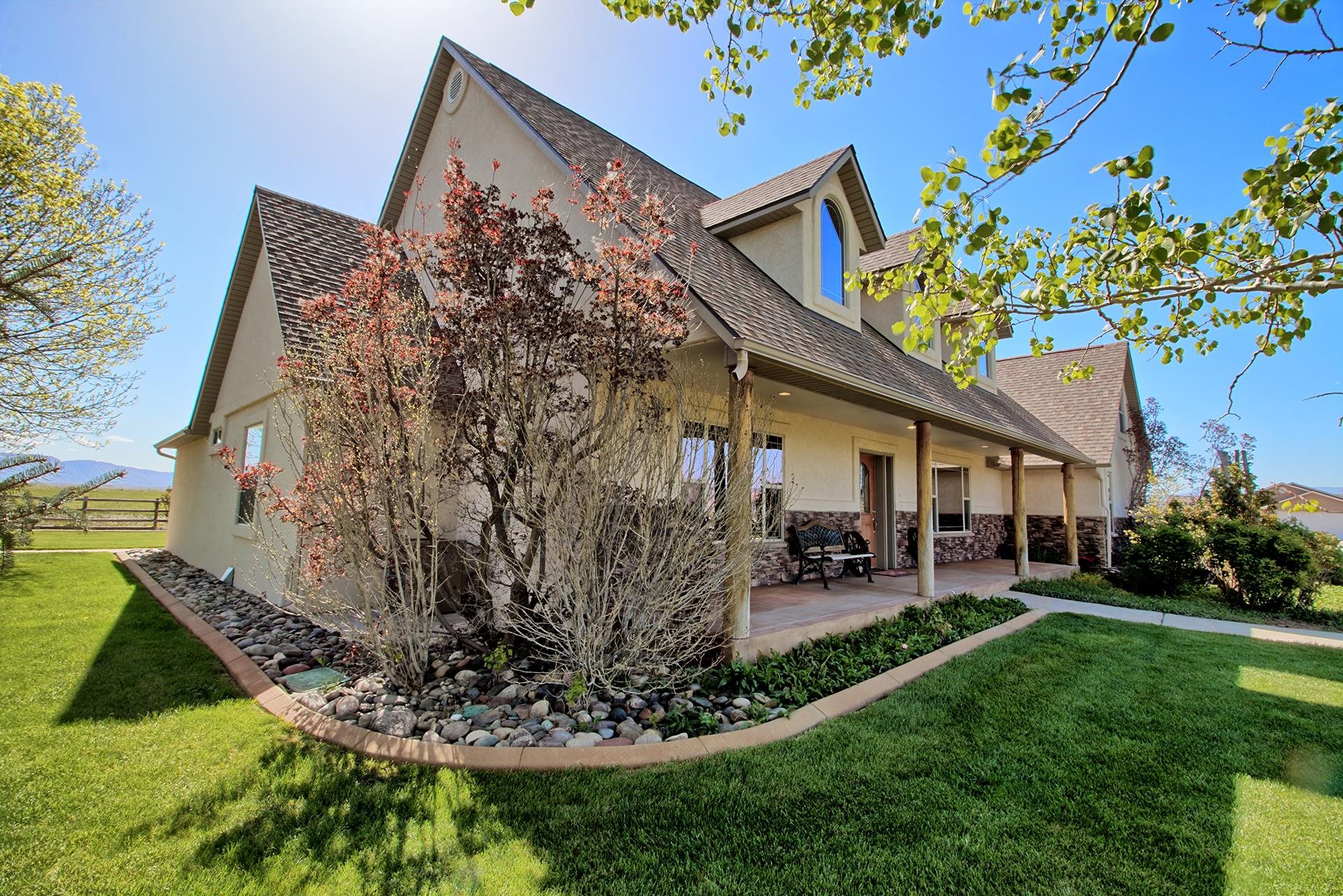2302 Outback Ridge Road Grand Junction, CO 81505 - Photo 7 of 42 a view of a house with a yard patio and sitting area