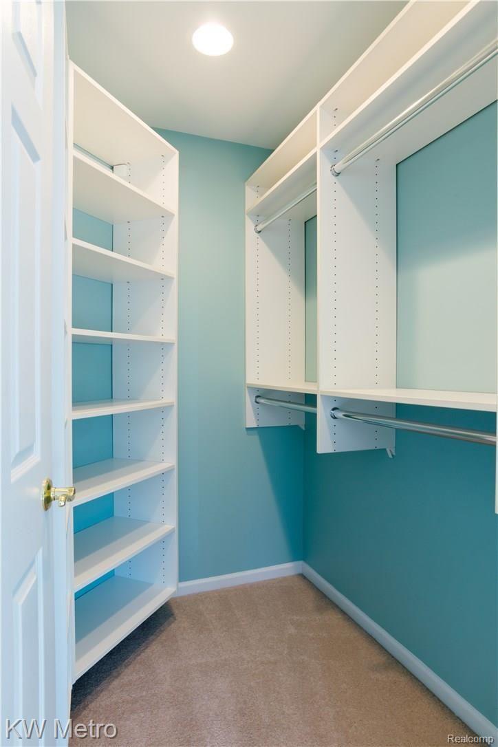 2211 West Wardlow Road Highland, MI 48357 - Photo 20 of 53 Close up of the walk-in closet w/ shelves.