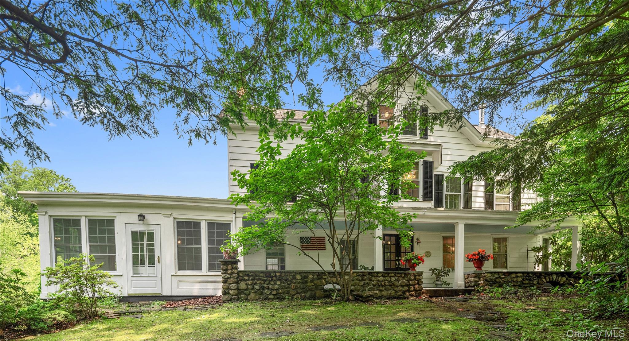 27 Bedford Road Pleasantville, NY 10570 - Photo 1 of 1 front view of a house with a yard
