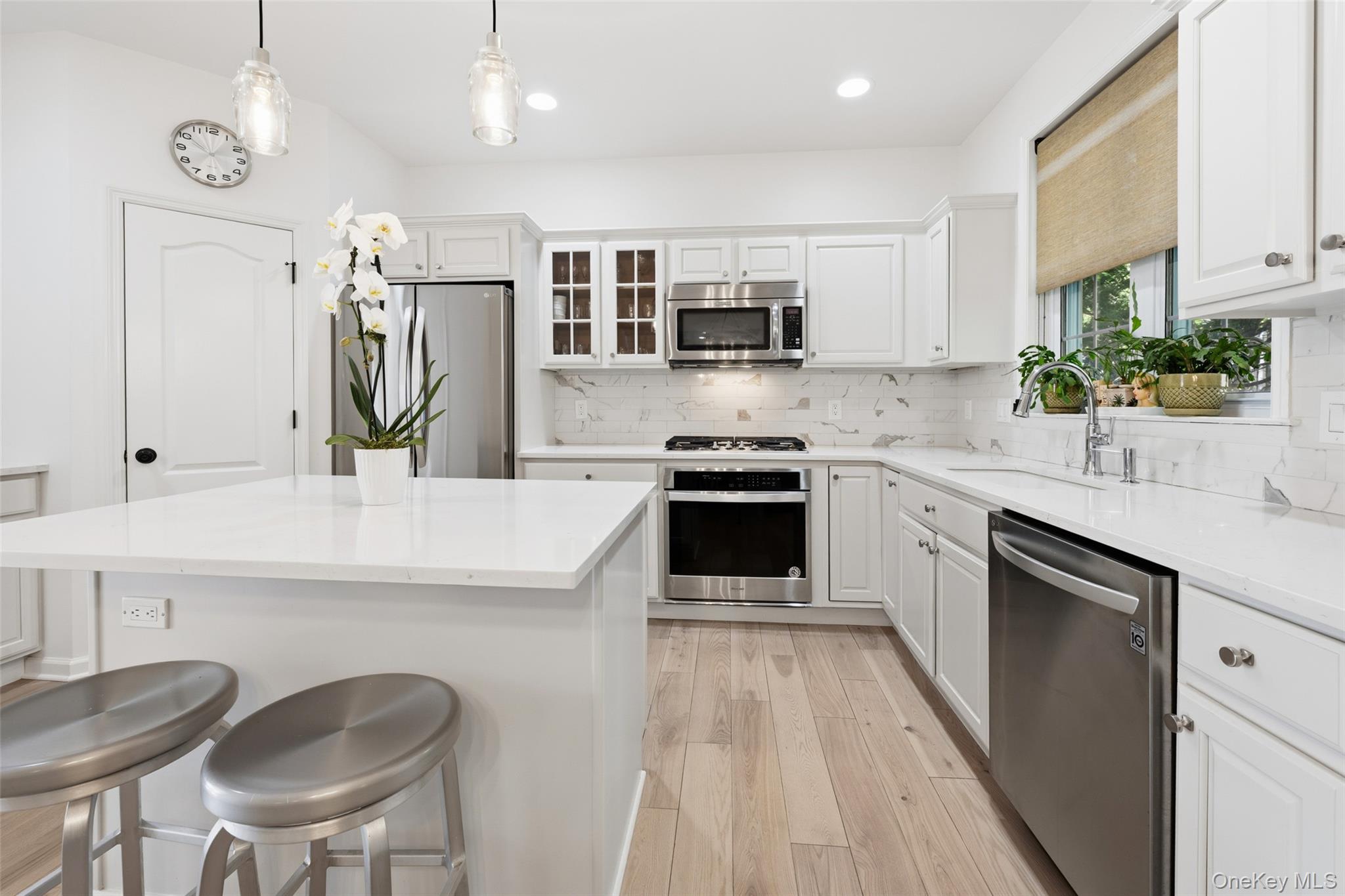 40 Bellefair Road Rye Brook, NY 10573 - Photo 12 of 43 Another view of the kitchen with Quartz counter tops and stainless steel appliances