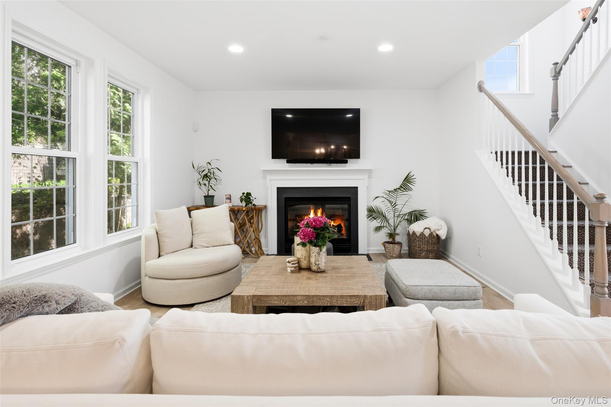 40 Bellefair Road Rye Brook, NY 10573 - Photo 17 of 43 Beautiful Family room with gas fireplace and walls of windows
