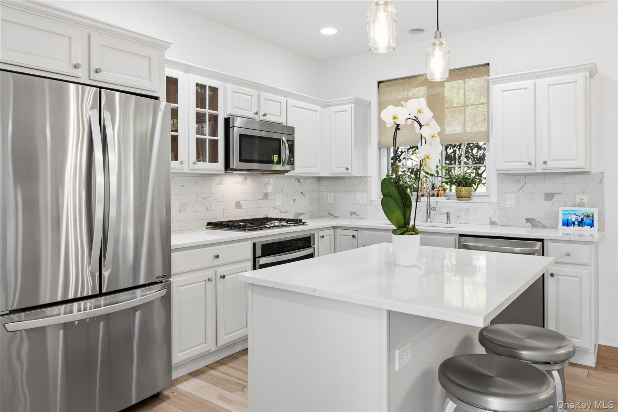 40 Bellefair Road Rye Brook, NY 10573 - Photo 9 of 43 Gourmet chef's kitchen with fabulous island and stainless steel appliances