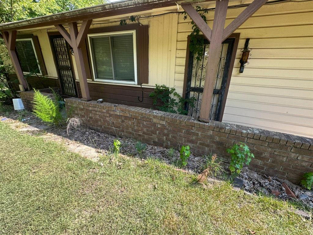 1219 Canal Street Ringgold, LA 71068 - Photo 2 of 14 a front view of a house with garden