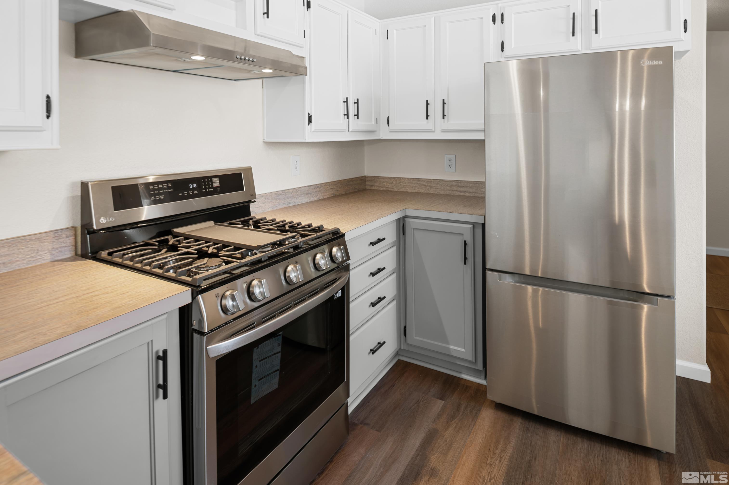 10 Rodeo Drive Reno, NV 89508 - Photo 12 of 37 a kitchen with cabinets and steel stainless steel appliances