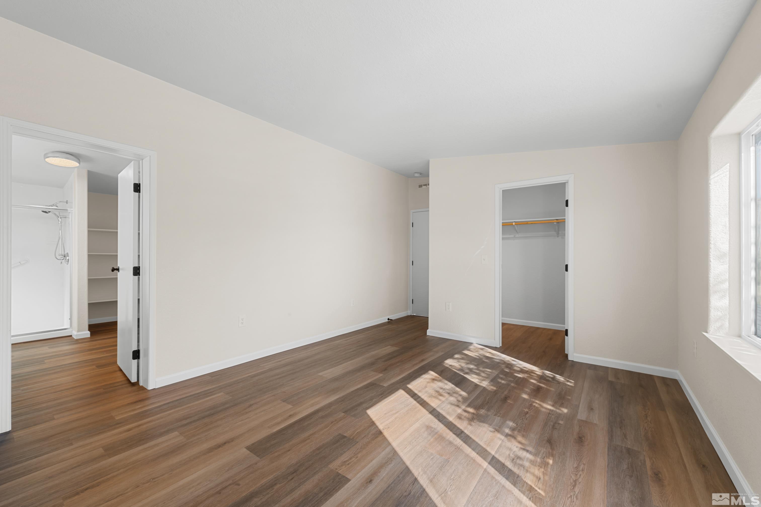 10 Rodeo Drive Reno, NV 89508 - Photo 15 of 37 an empty room with wooden floor and windows