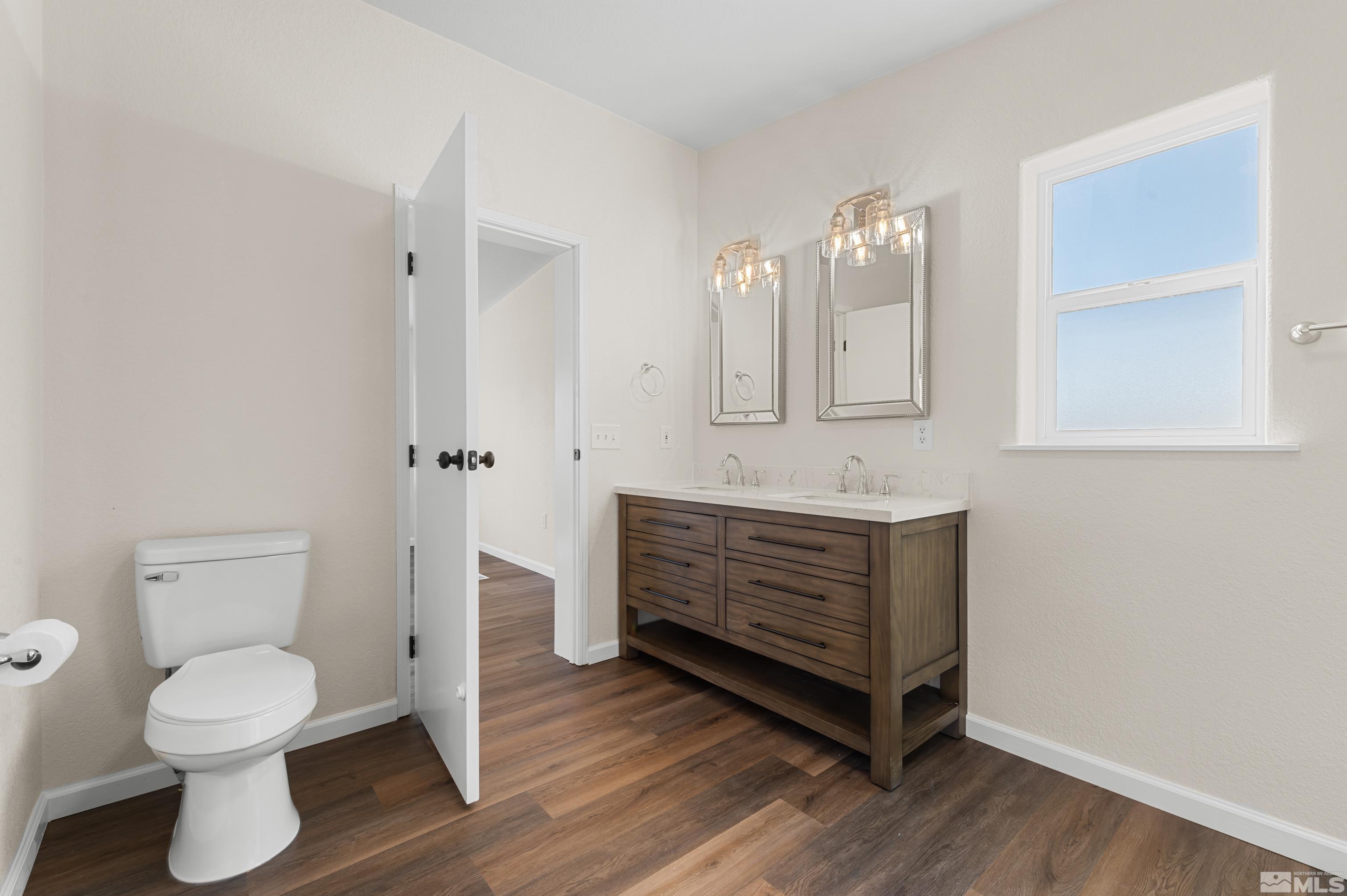 10 Rodeo Drive Reno, NV 89508 - Photo 17 of 37 a bathroom with a sink and a mirror