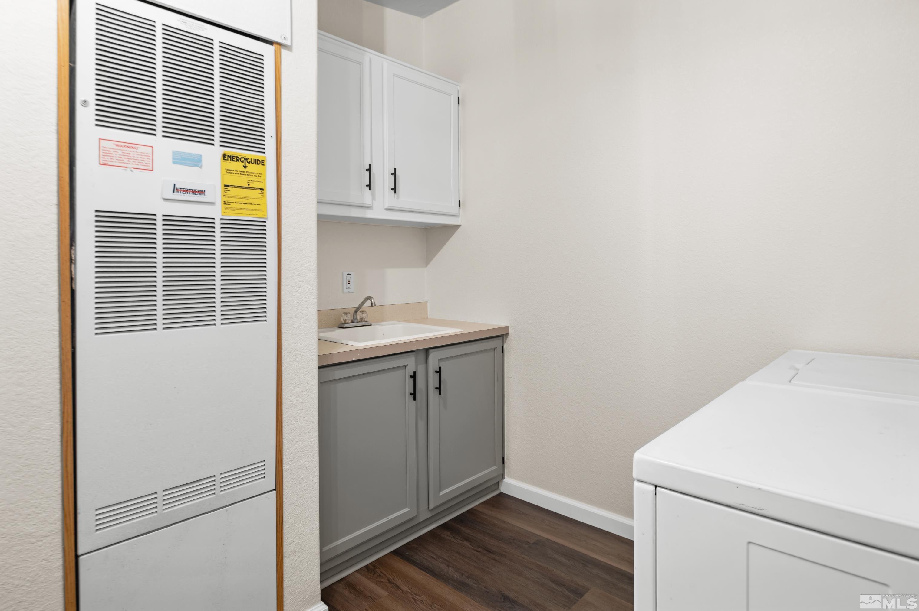 10 Rodeo Drive Reno, NV 89508 - Photo 23 of 37 a storage room with wooden floor washer and dryer