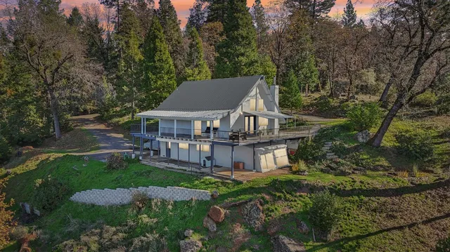 a house that has tree in front of it