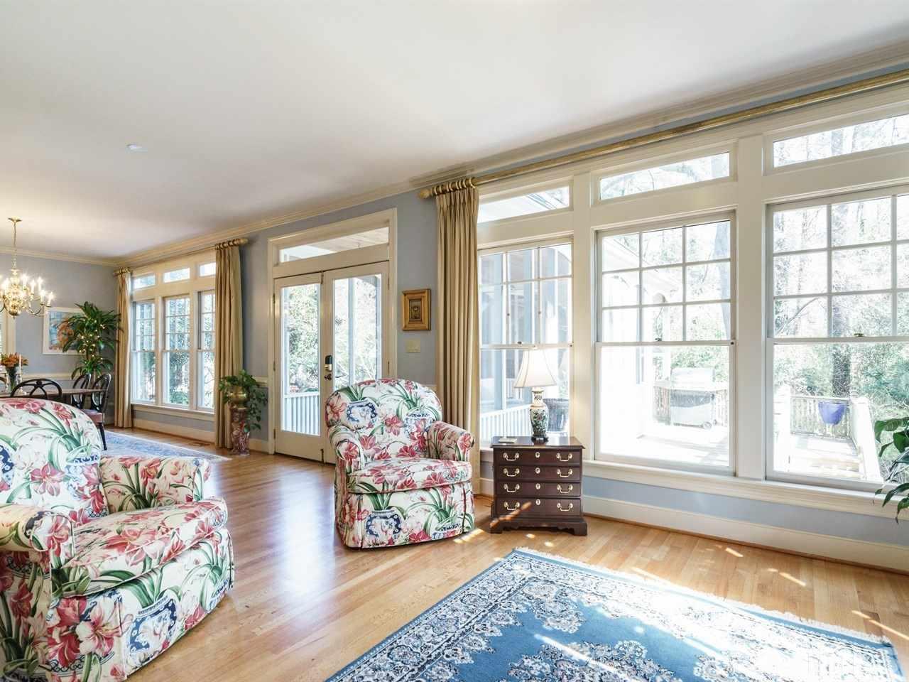 3100 White Oak Road Raleigh, NC 27609 - Photo 8 of 25 a living room with furniture and floor to ceiling windows