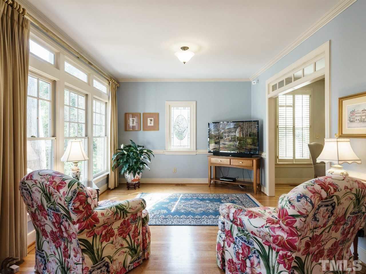 3100 White Oak Road Raleigh, NC 27609 - Photo 9 of 25 a living room with furniture and a large window