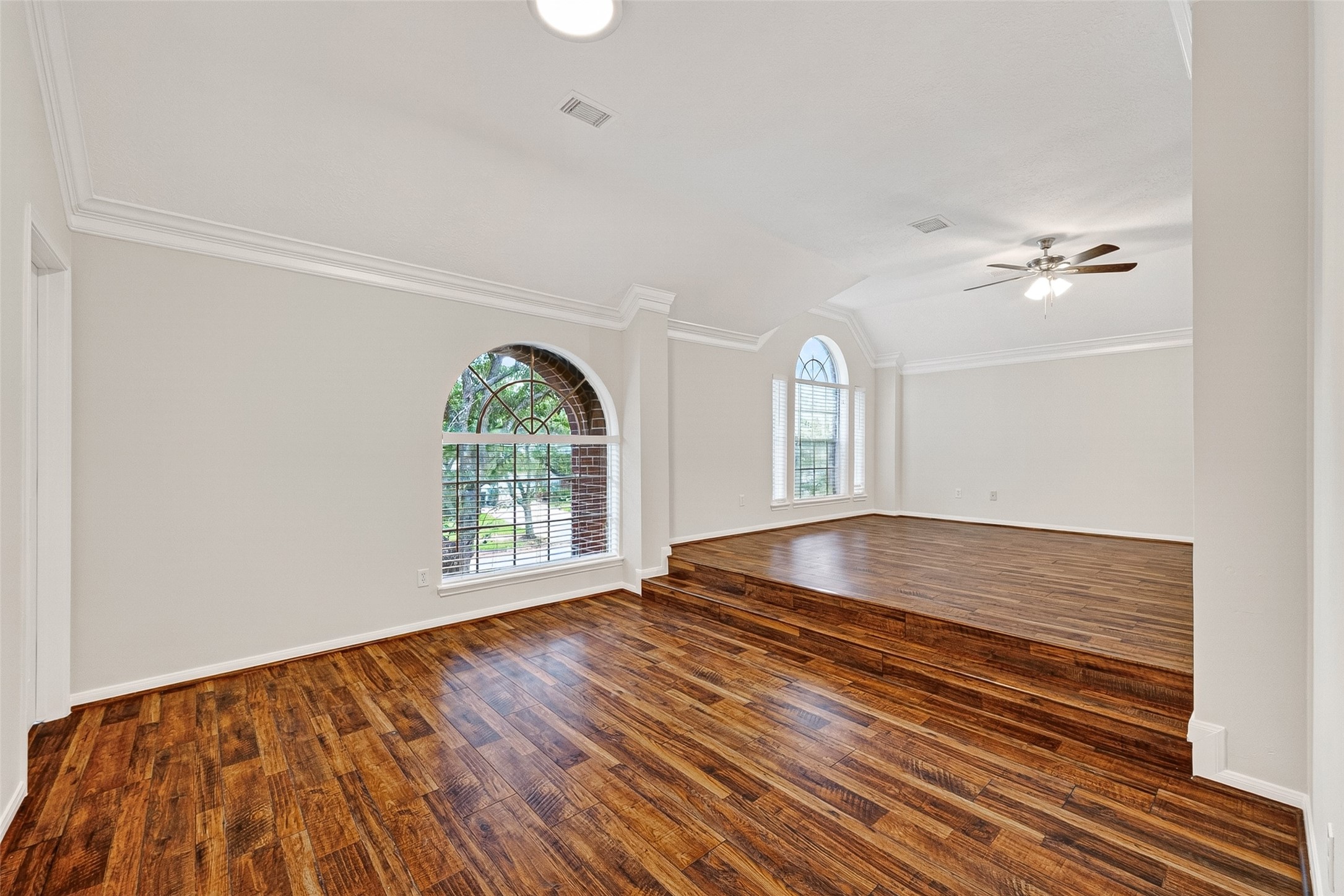 4539 Springfield Lakes Street Sugar Land, TX 77479 - Photo 24 of 34 a view of an empty room with a window and wooden floor