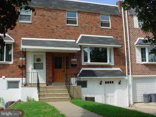 12420 Sweet Briar Road Philadelphia, PA 19154 - Photo 1 of 4 a front view of a house with a yard