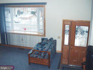12420 Sweet Briar Road Philadelphia, PA 19154 - Photo 4 of 4 a living room with furniture and a window