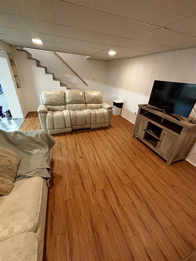1032 Windy Ridge Drive Bedford, VA 24523 - Photo 26 of 27 a living room with furniture and a flat screen tv
