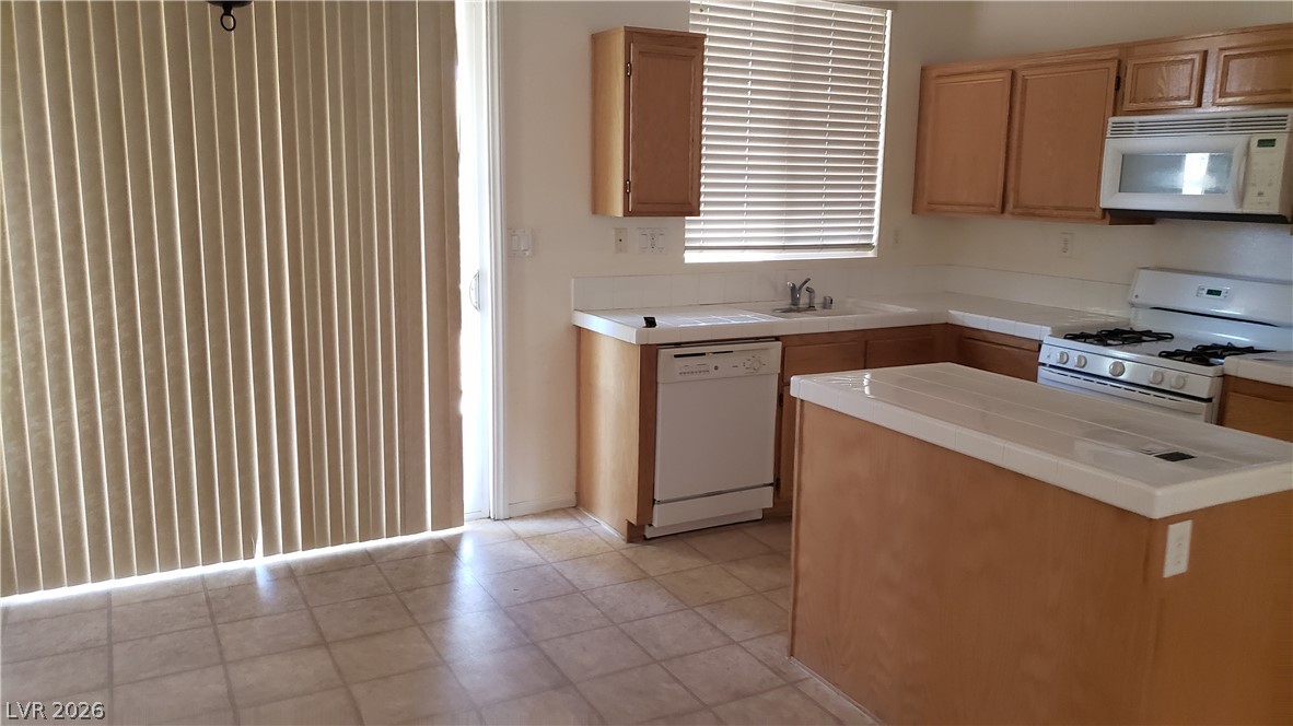 9112 Manalang Road Las Vegas, NV 89123 - Photo 30 of 50 A well-equipped kitchen features a functional layout with ample counter space and a convenient kitchen island.
