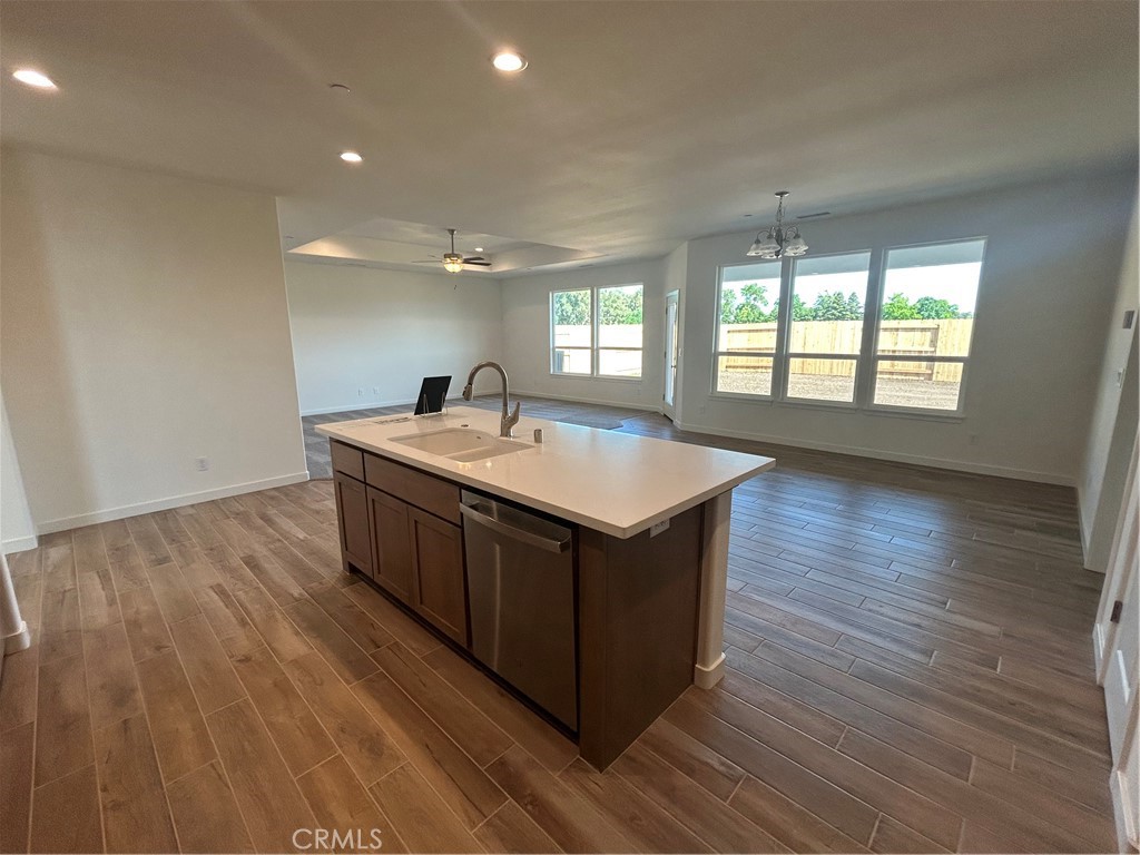 325 Bainbridge Place Chico, CA 95973 - Photo 11 of 26 a kitchen with a sink and wooden floor