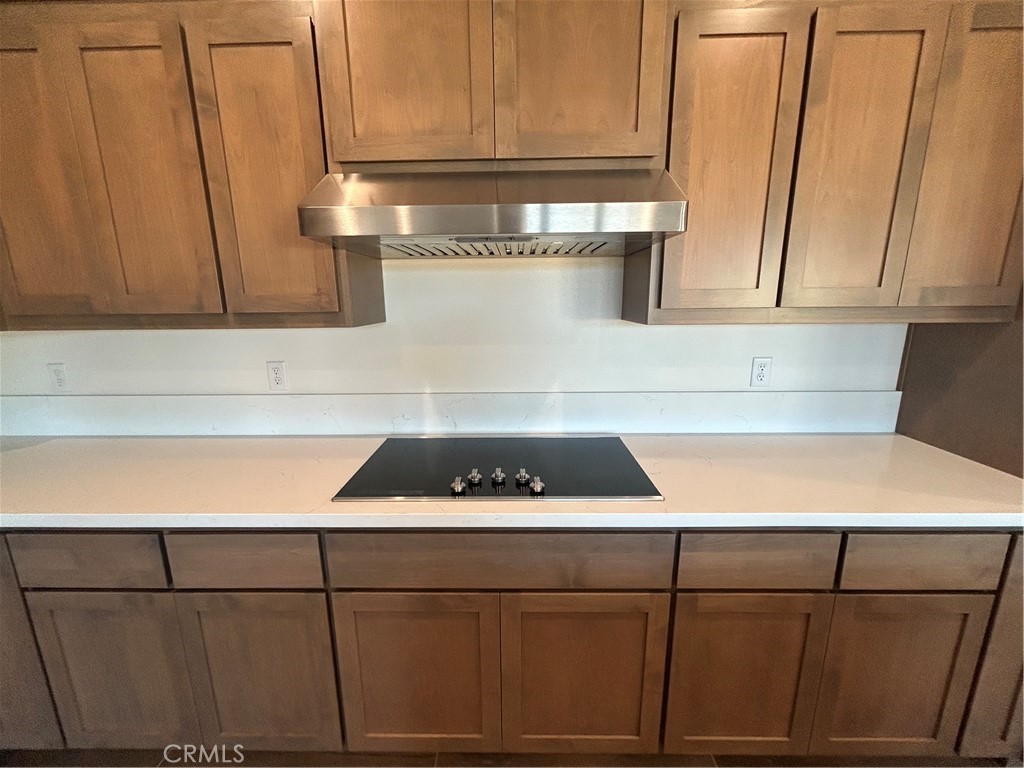 325 Bainbridge Place Chico, CA 95973 - Photo 12 of 26 a kitchen with a cabinets and a stove