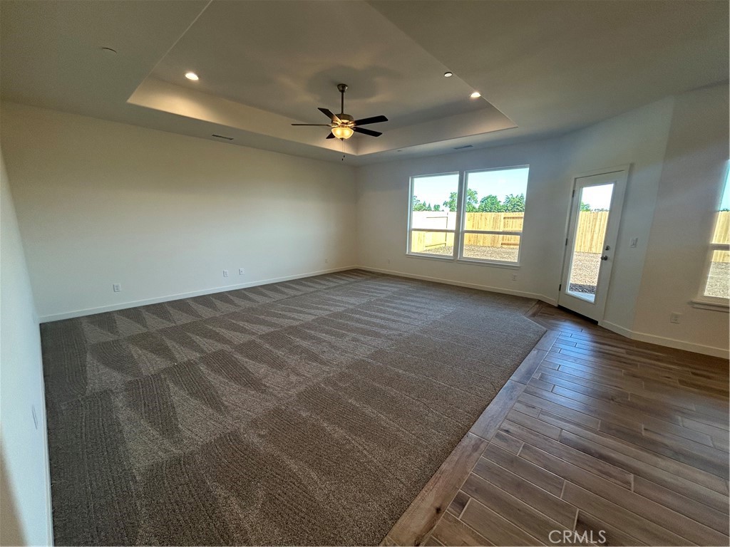 325 Bainbridge Place Chico, CA 95973 - Photo 17 of 26 an empty room with wooden floor and windows