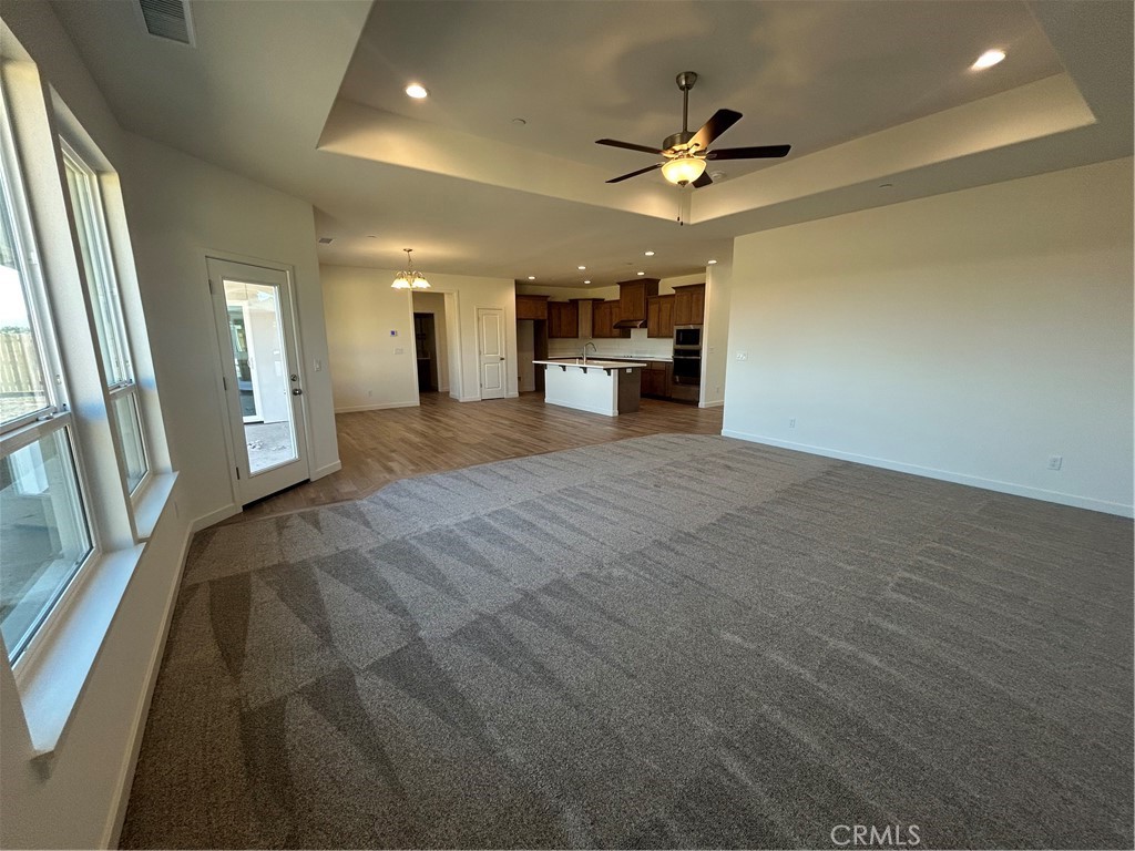 325 Bainbridge Place Chico, CA 95973 - Photo 18 of 26 an empty room with cabinet and a ceiling fan