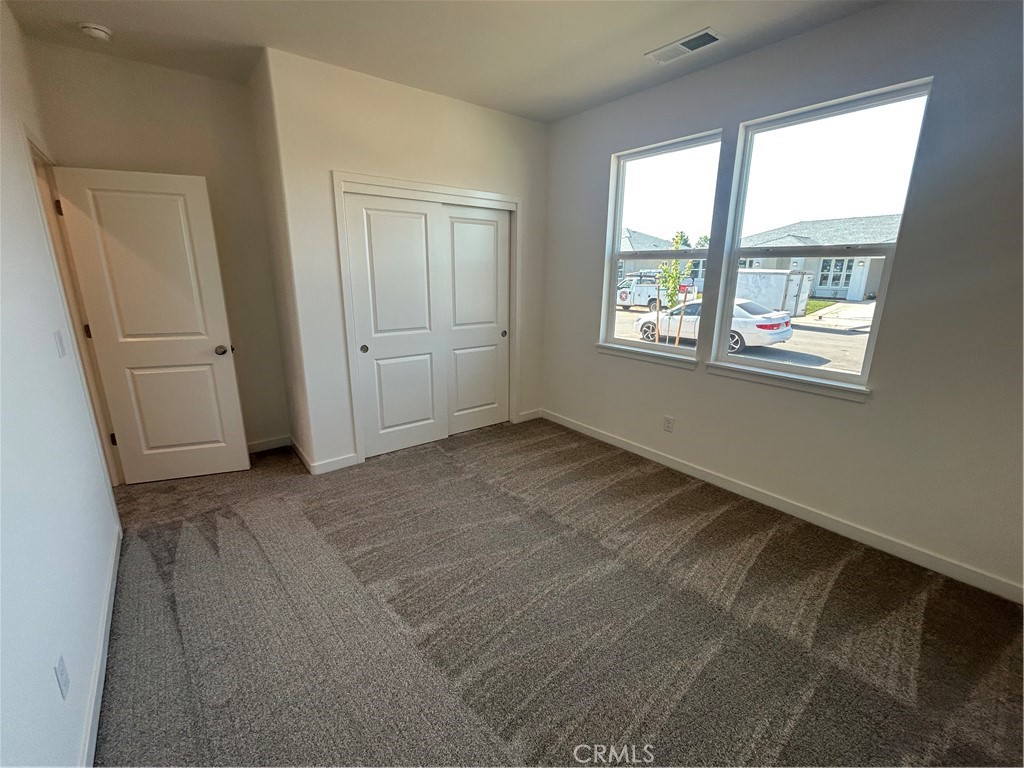 325 Bainbridge Place Chico, CA 95973 - Photo 8 of 26 an empty room with windows and closet