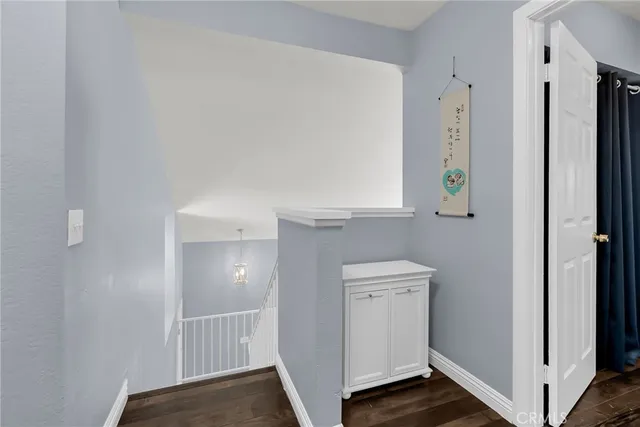 a view of hallway with wooden floor