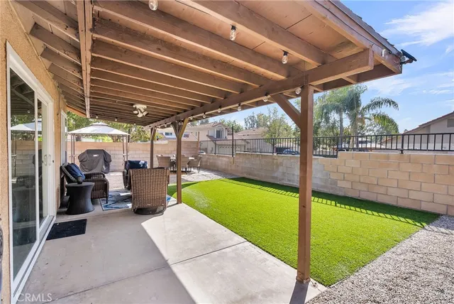 a view of a backyard with swimming pool
