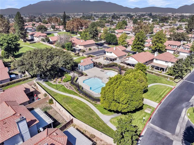 an aerial view of residential houses with outdoor space