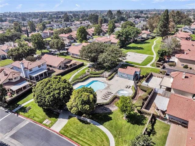 an aerial view of a house with garden space and outdoor seating