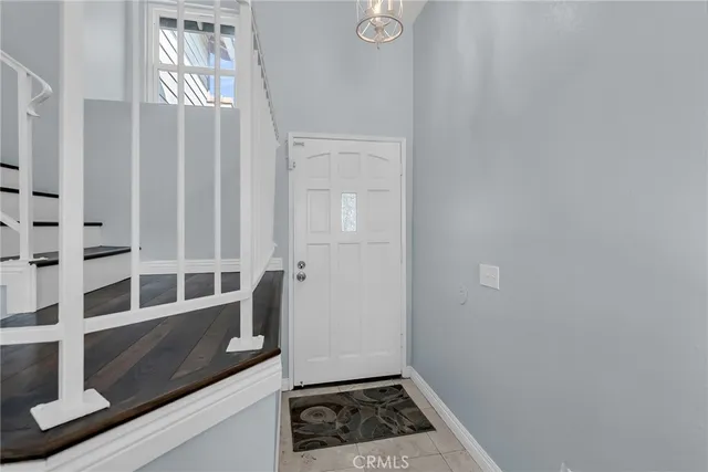 a view of wooden door and utility room