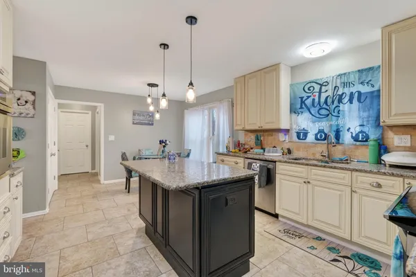 a kitchen with a sink a counter top space and appliances
