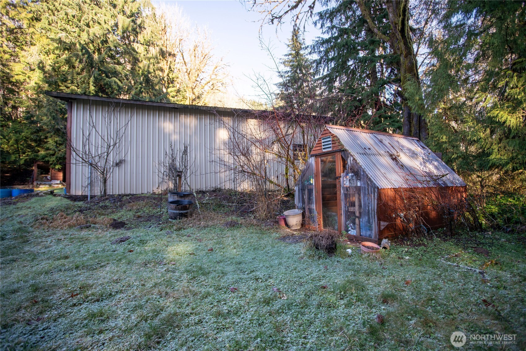 371 Pigeon Springs Road Onalaska, WA 98570 - Photo 24 of 39 a view of a small house with a small yard and large trees