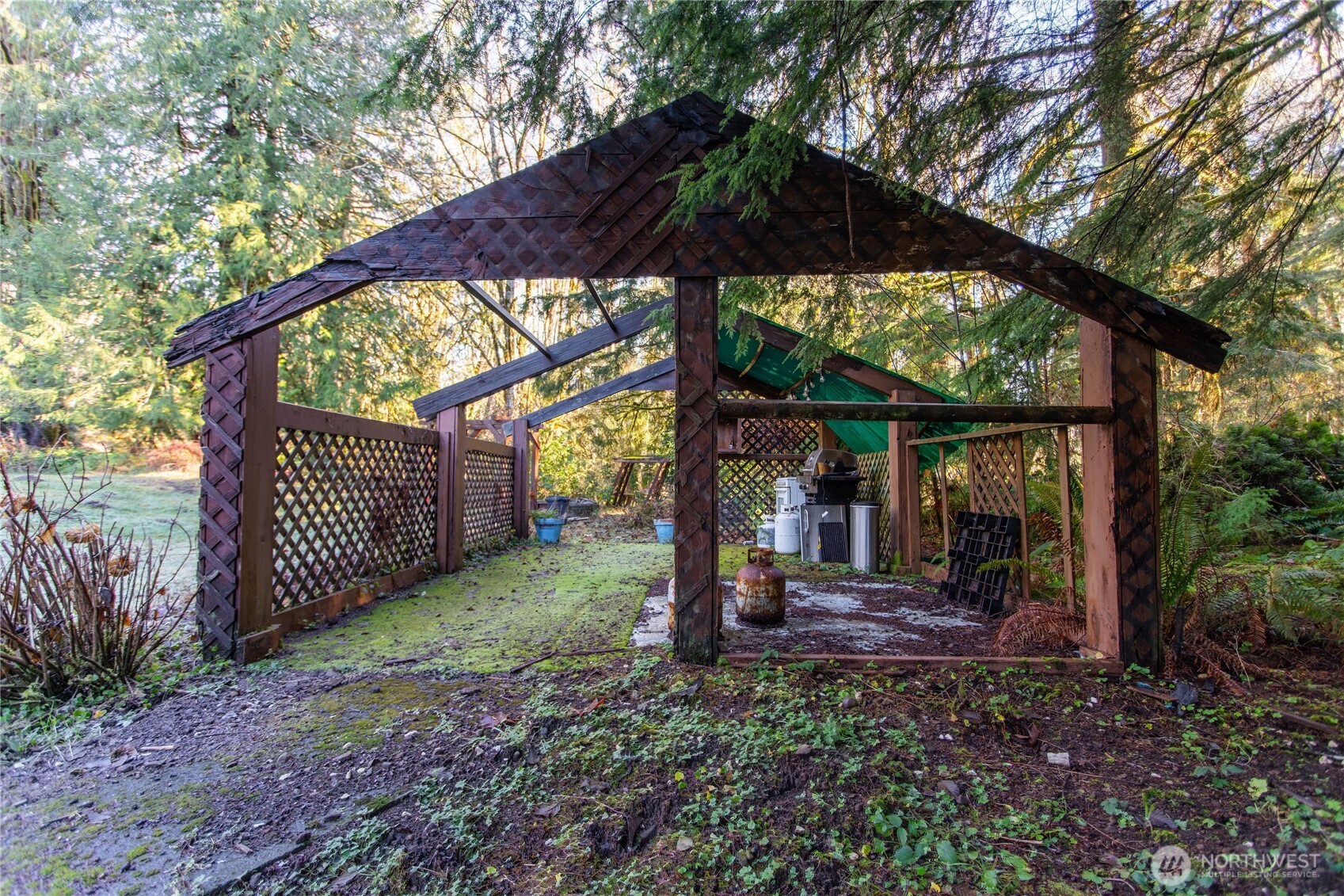 371 Pigeon Springs Road Onalaska, WA 98570 - Photo 26 of 39 a view of a sink and backyard with large trees