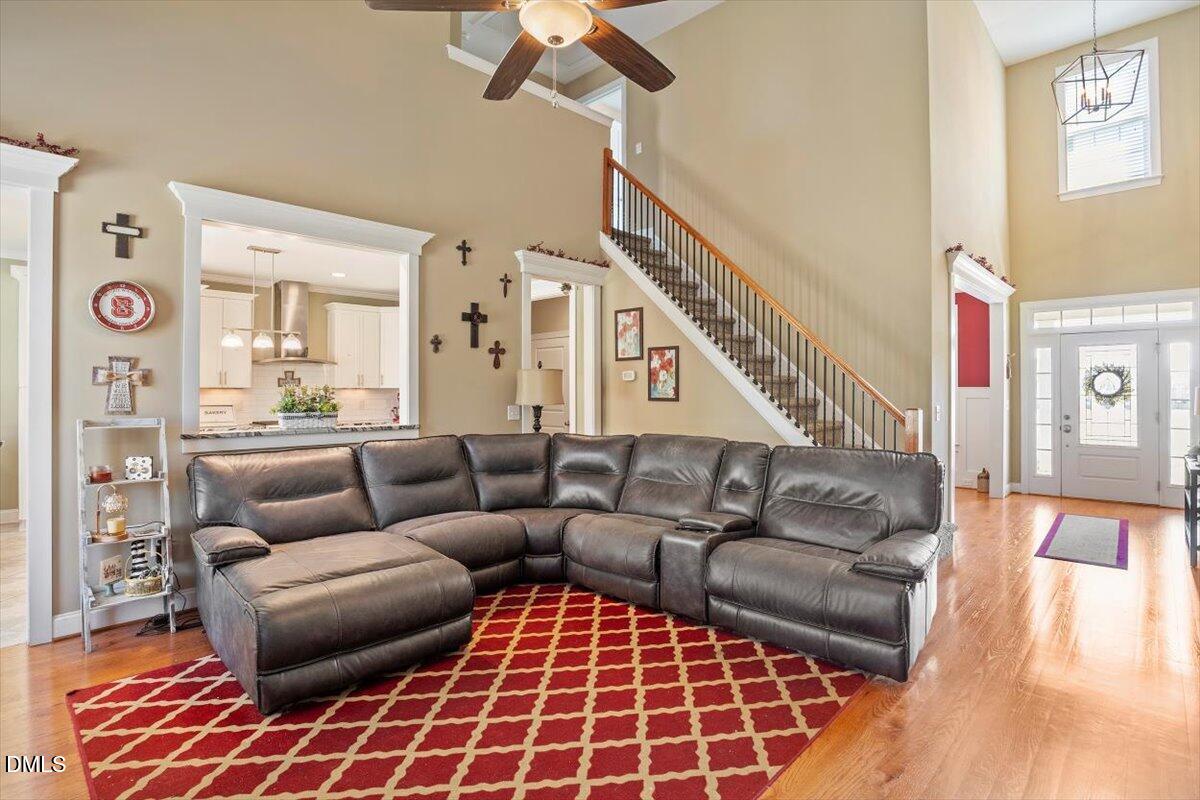 1001 Bellewood Farms Road Raleigh, NC 27603 - Photo 15 of 39 a living room with furniture and a wooden floor