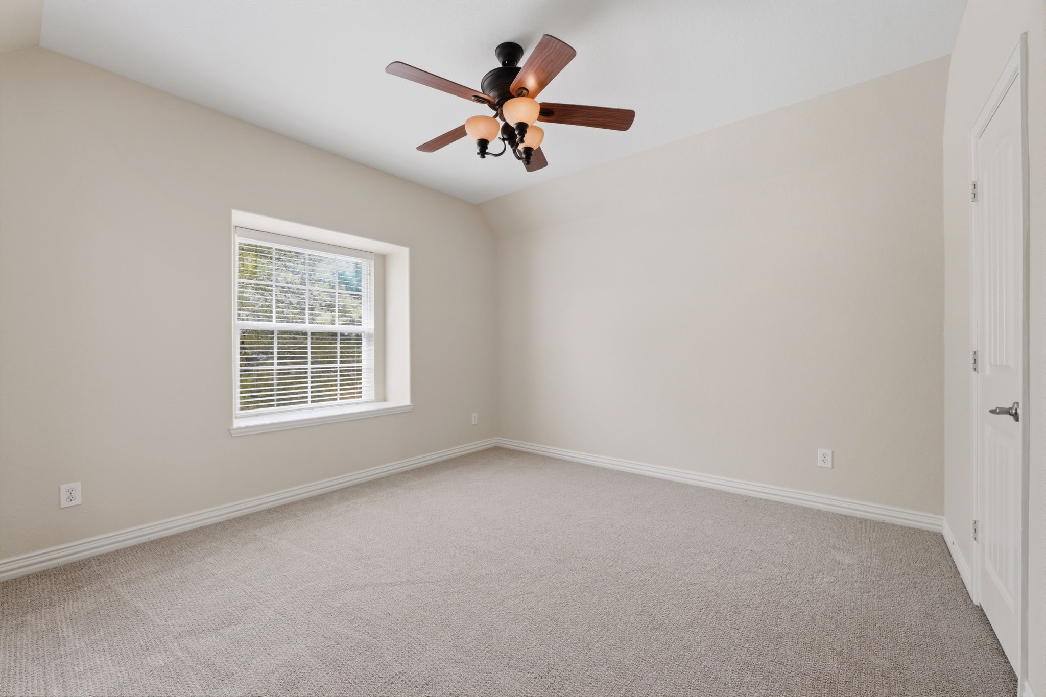 315 Arbor Ridge Lane Conroe, TX 77384 - Photo 32 of 48 an empty room with a window and a ceiling fan
