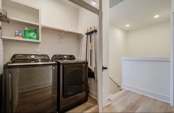 a utility room with closet dryer and washer