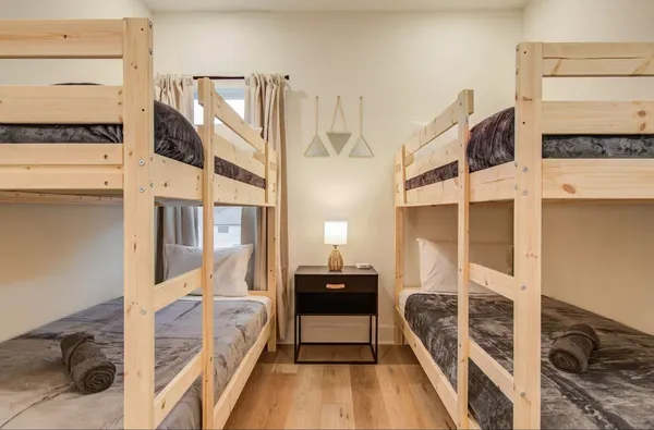 a bedroom with a bed and a view of walk in closet