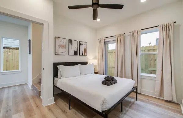 a bedroom with a bed and a window