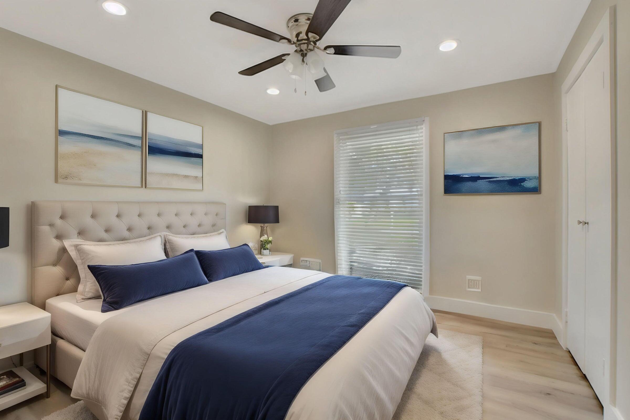 1599 Isabel Este Road Boca Raton, FL 33486 - Photo 13 of 22 a bedroom with a large bed and a ceiling fan